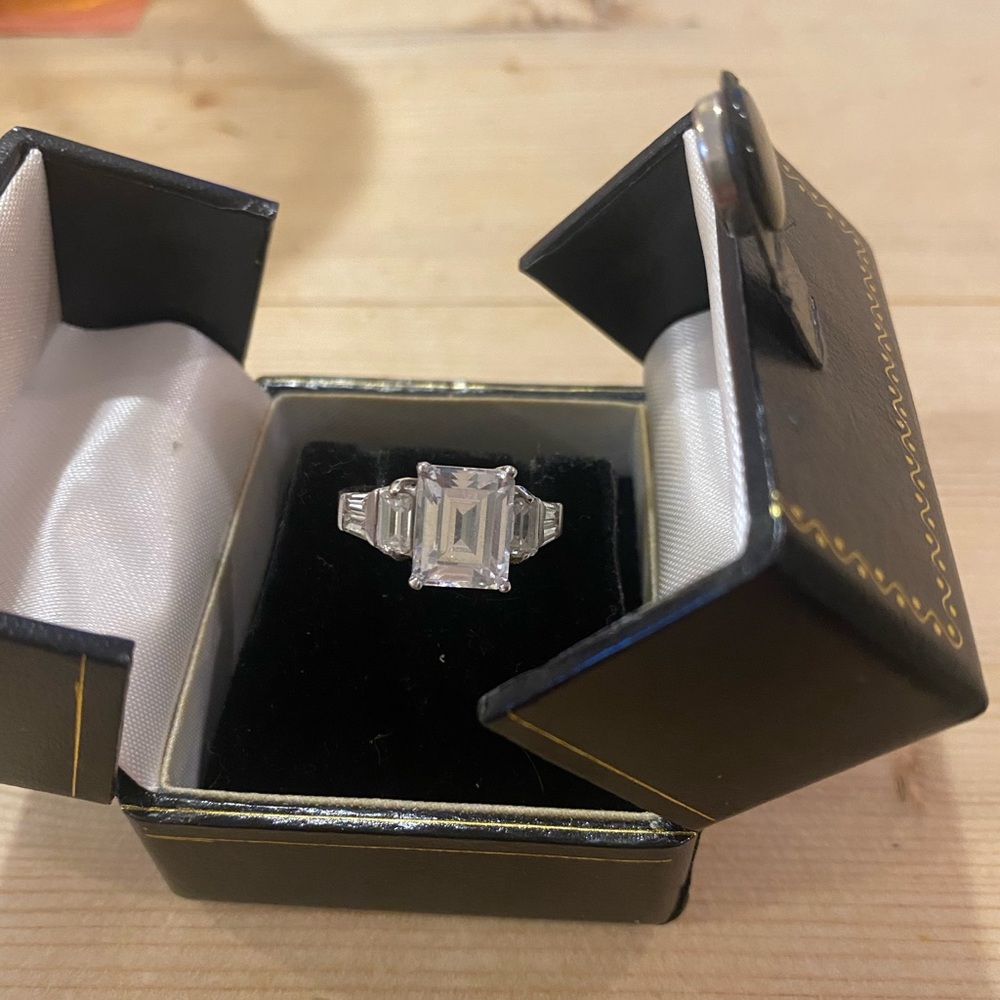 Silver Ring with Three Stone Design and Emerald Cut 5A Cubic Zirconia.